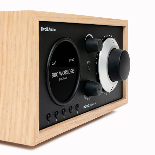 The Model One+ offers a sophisticated blend of classic design and modern audio technology, perfectly suited for any setting. This versatile table radio provides comprehensive listening options, including crystal-clear DAB/DAB+ digital radio, traditional FM, and convenient Bluetooth connectivity for wireless streaming.