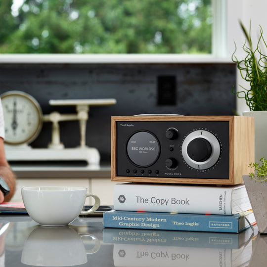 The Model One+ offers a sophisticated blend of classic design and modern audio technology, perfectly suited for any setting. This versatile table radio provides comprehensive listening options, including crystal-clear DAB/DAB+ digital radio, traditional FM, and convenient Bluetooth connectivity for wireless streaming.