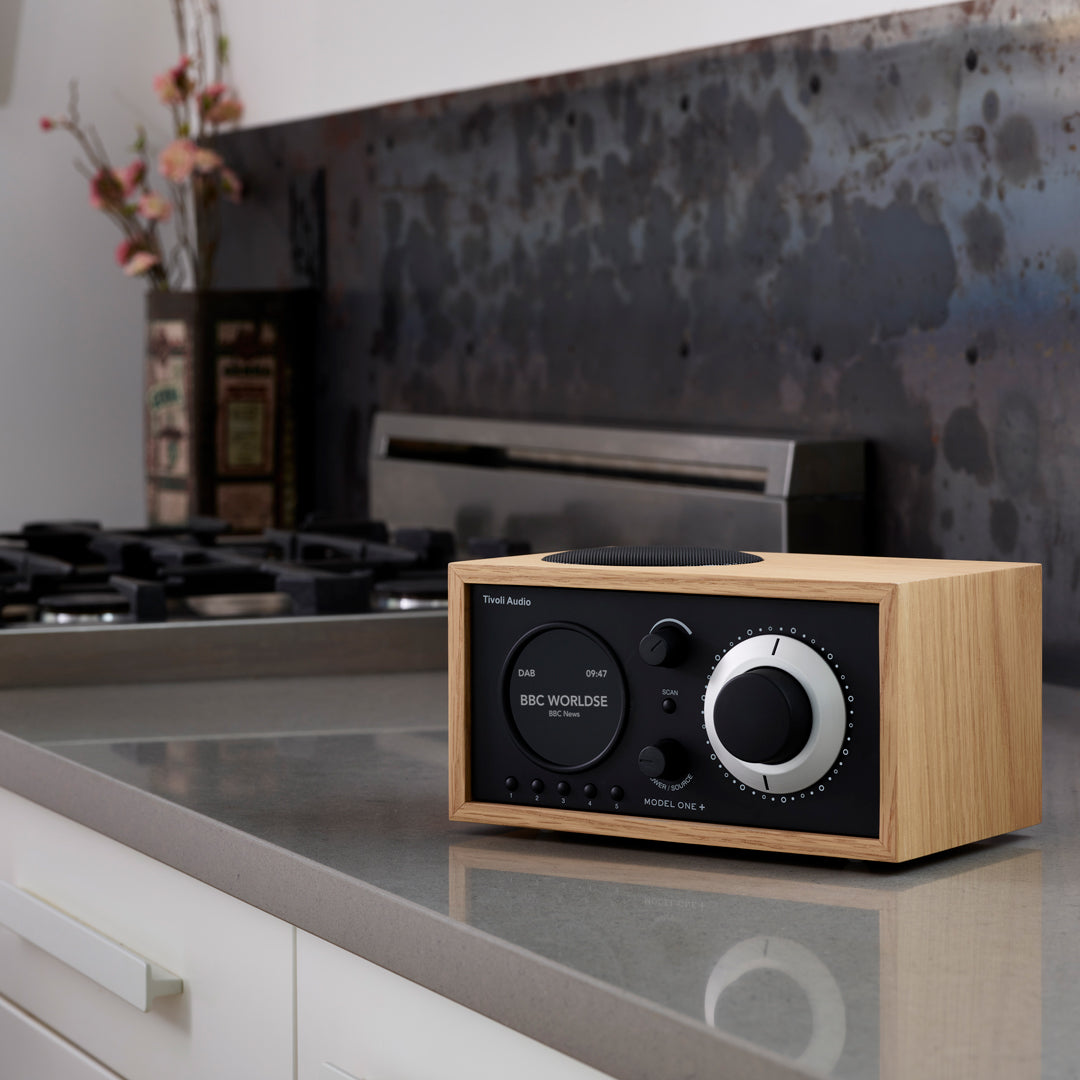 The Model One+ offers a sophisticated blend of classic design and modern audio technology, perfectly suited for any setting. This versatile table radio provides comprehensive listening options, including crystal-clear DAB/DAB+ digital radio, traditional FM, and convenient Bluetooth connectivity for wireless streaming.