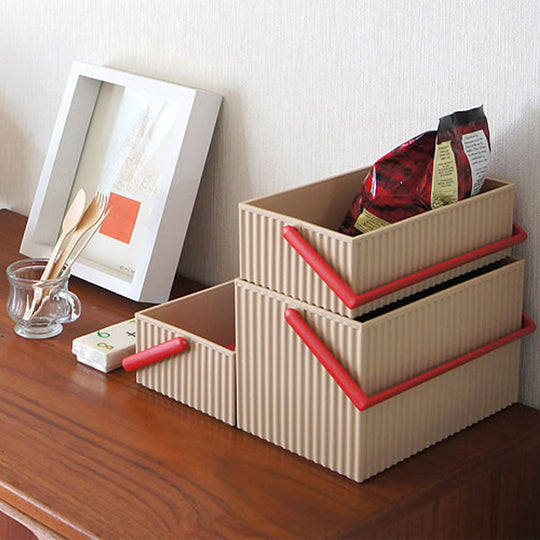 Omnioffre is a range of stylish Japanese stackable storage boxes with colour coordinated carry handles.