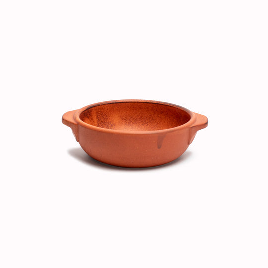 A hand finished Japanese contemporary over proof dish featuring handles and an orange glaze.&nbsp;