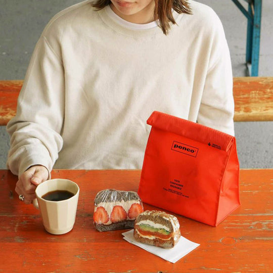 Orange Roll Top Pouch from Penco, offers a convenient seal by rolling up the top similar to a paper bag