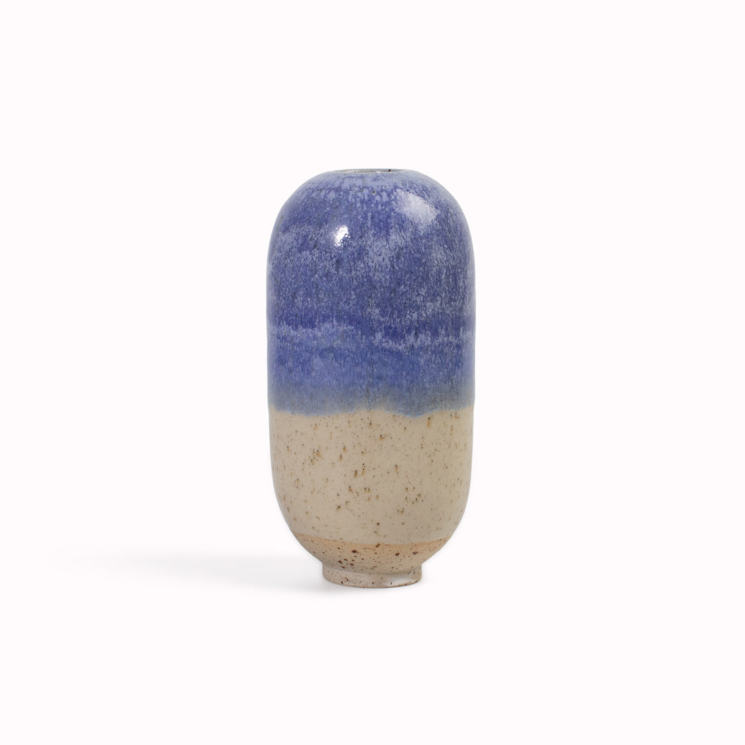 The Orinoco&nbsp;design is hand-thrown in watertight stoneware. Due to the rounded taper at the top of the vase, the glaze melts down the sides of the cylindrical vase mimicking melting ice.&nbsp;