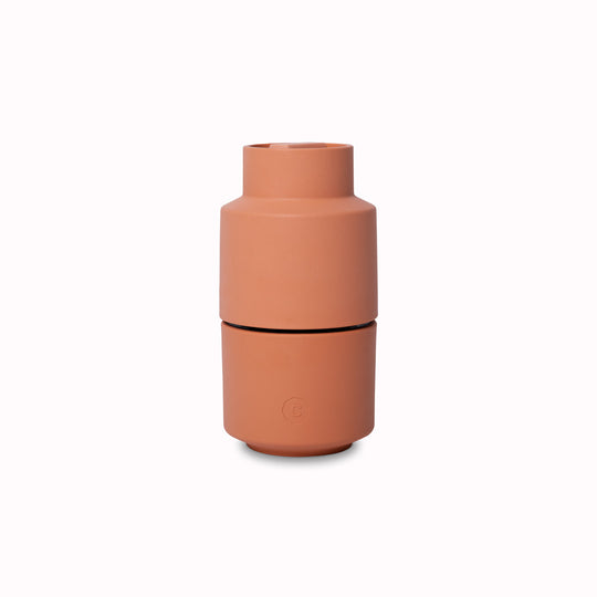 An earthy Papika coloured Danish designed Billund spice grinder from CrushGrind is a 12cm tall upside-down grinder with a powerful ceramic grinding module that makes easy work of grinding salt, pepper, dried herbs and most spices