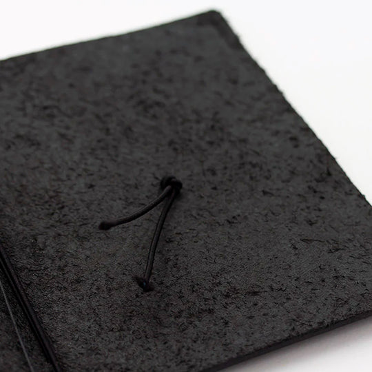 The Traveler's Notebook - Passport Size is a compact, passport‑sized notebook system built for personal organisation, journaling and creative planning. It pairs a handmade cowhide leather cover from Thailand with a blank MD paper insert crafted in Japan
