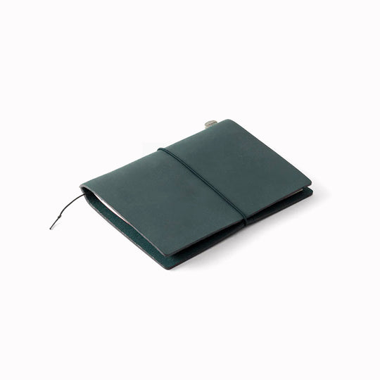 The Traveler's Notebook - Passport Size is a compact, passport‑sized notebook system built for personal organisation, journaling and creative planning. It pairs a handmade cowhide leather cover from Thailand with a blank MD paper insert crafted in Japan