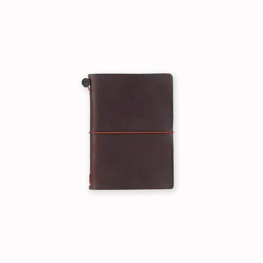 The Traveler's Notebook - Passport Size is a compact, passport‑sized notebook system built for personal organisation, journaling and creative planning. It pairs a handmade cowhide leather cover from Thailand with a blank MD paper insert crafted in Japan
