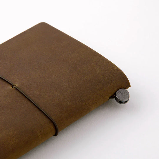 The Traveler's Notebook - Passport Size is a compact, passport‑sized notebook system built for personal organisation, journaling and creative planning. It pairs a handmade cowhide leather cover from Thailand with a blank MD paper insert crafted in Japan