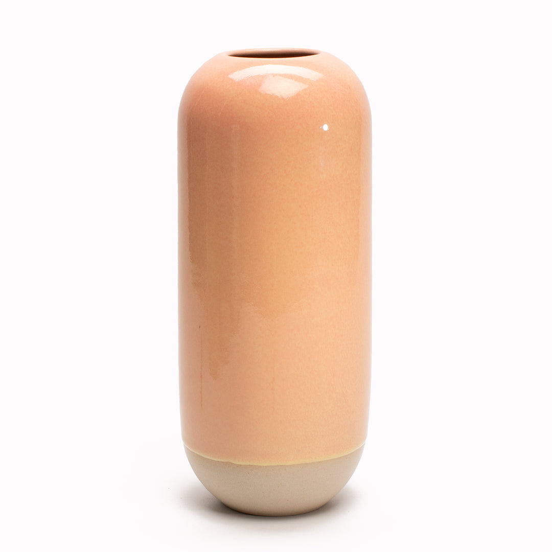 Peach is a soft pink orange hued Yuki Ceramic Vase that is drip glazed and hand-thrown in watertight stoneware.