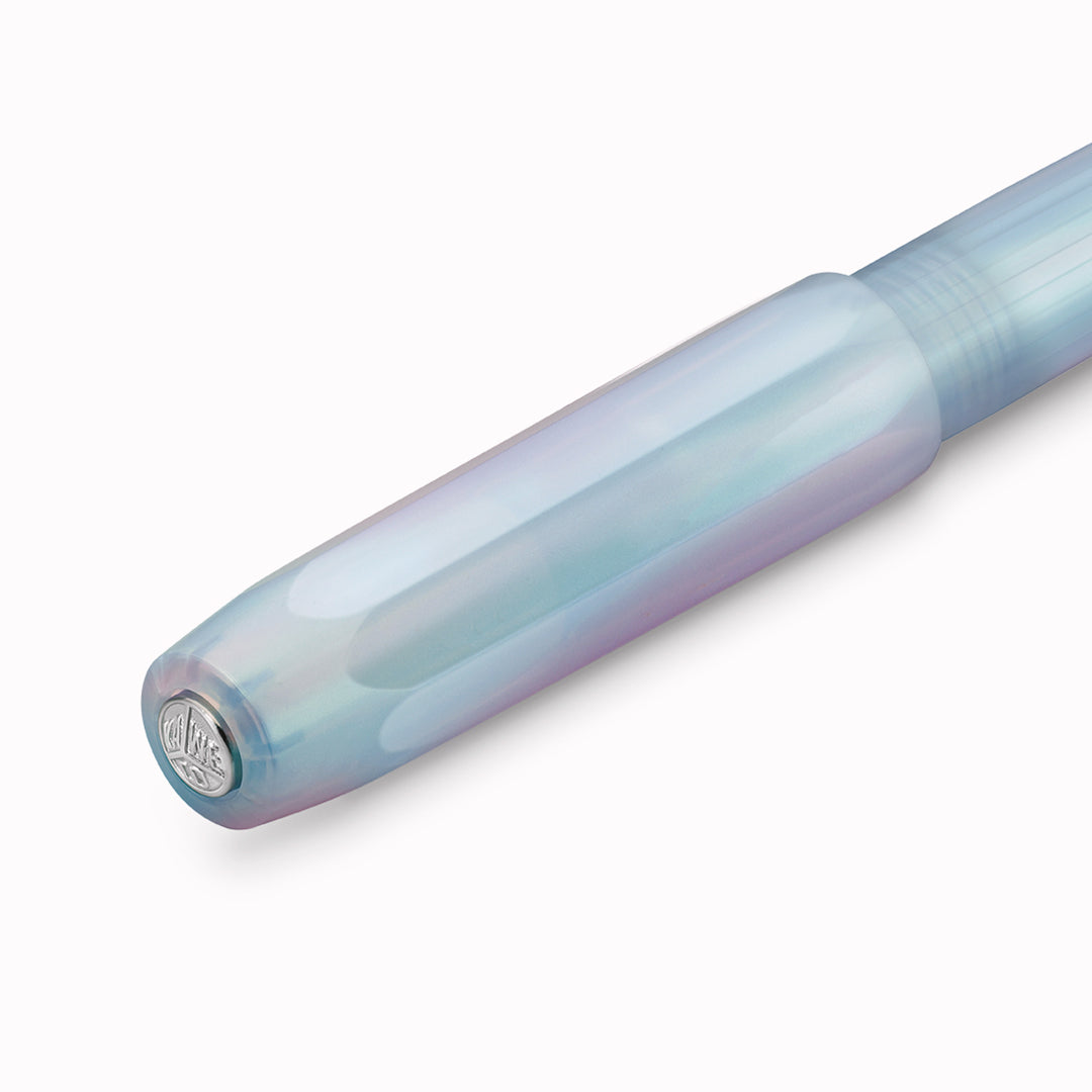 The Kaweco Perkeo rollerball pen in Irridescent Pearl features an ergonomic grip, octagonal cap and hexadecagon shaped barrel.