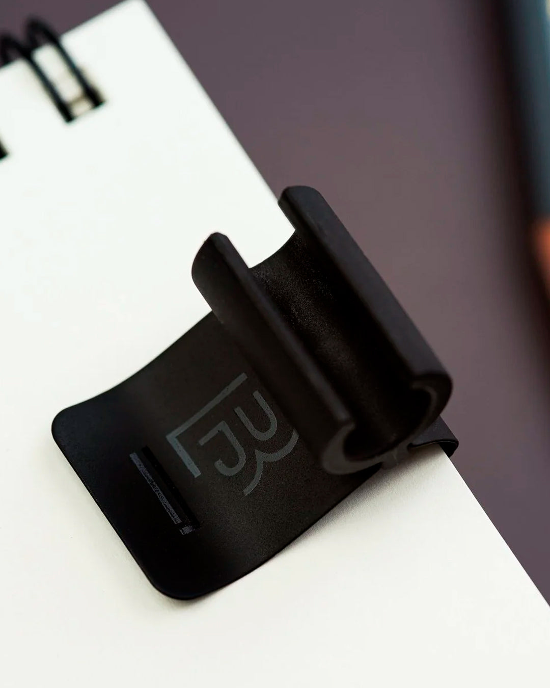 The Blackwing Pencil Holder is a simple metal clip designed to attach securely to the cover of your favourite notebook, giving your pencil a dedicated place to live.