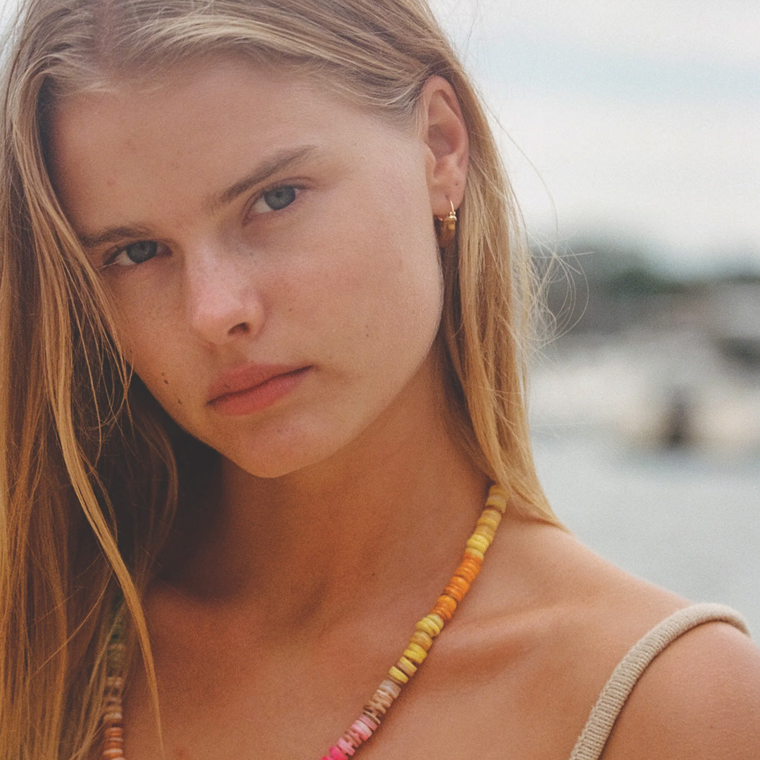 The Petit Swell Amber Hoops from Anni Lu highlight the brand's commitment to craftsmanship and style.