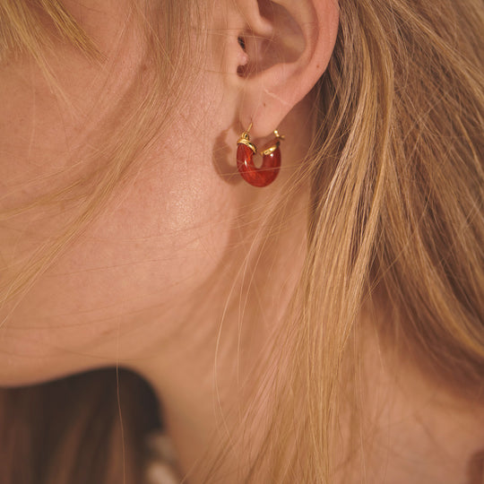 The Petit Swell Bright Red Hoops from Anni Lu highlight the brand's commitment to craftsmanship and style. 