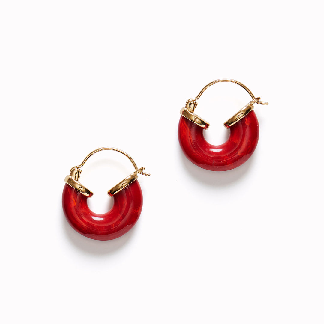 The Petit Swell Bright Red Hoops from Anni Lu highlight the brand's commitment to craftsmanship and style. 