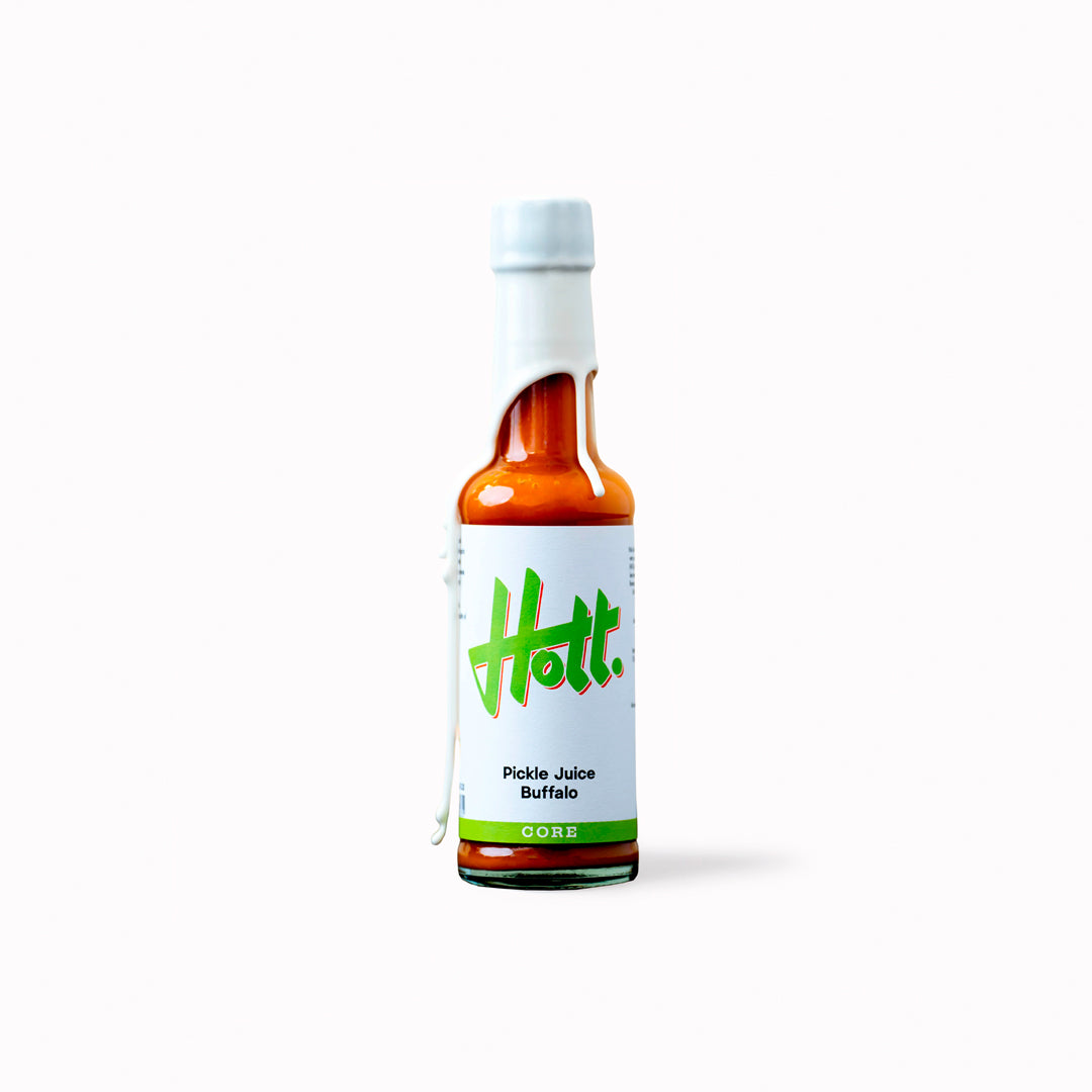 Hott Buffalo Pickle Juice has a medium buttery heat with a complex roasted garlic depth.