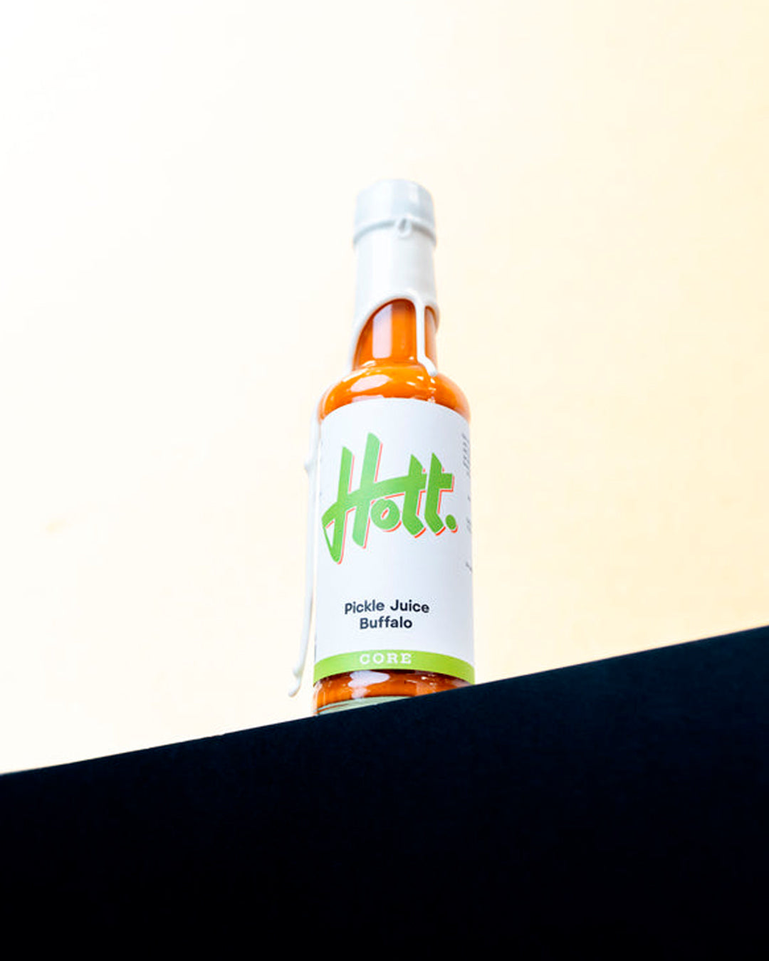 Hott Buffalo Pickle Juice has a medium buttery heat with a complex roasted garlic depth.