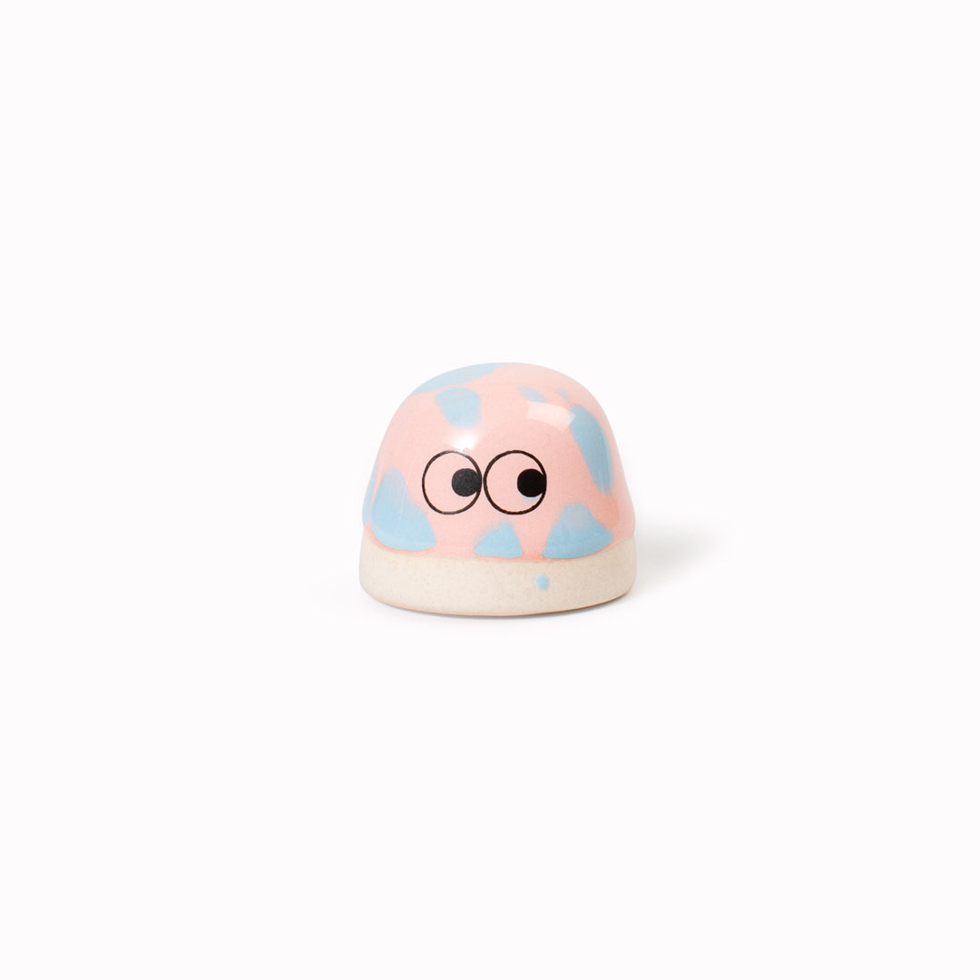 Inspired by Japanese Shinto beliefs that all objects have a soul each Familia Dot member is given life with a cute pair of eyes. They are hand-cast in solid, heavy white porcelain