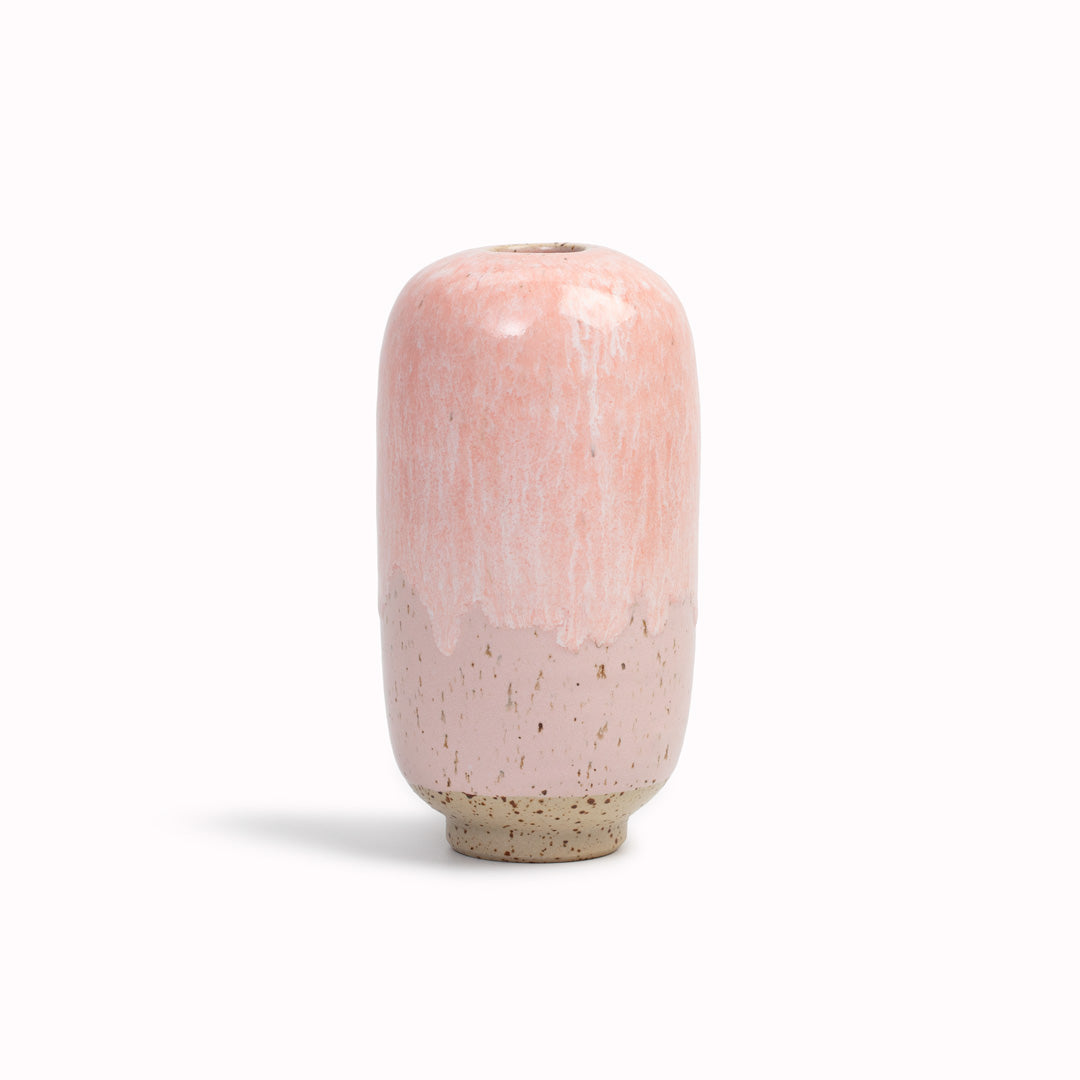The Pink Melt&nbsp;design is hand-thrown in watertight stoneware. Due to the rounded taper at the top of the vase, the glaze melts down the sides of the cylindrical vase mimicking melting ice.