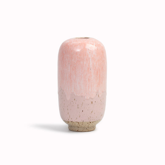 The Pink Melt&nbsp;design is hand-thrown in watertight stoneware. Due to the rounded taper at the top of the vase, the glaze melts down the sides of the cylindrical vase mimicking melting ice.