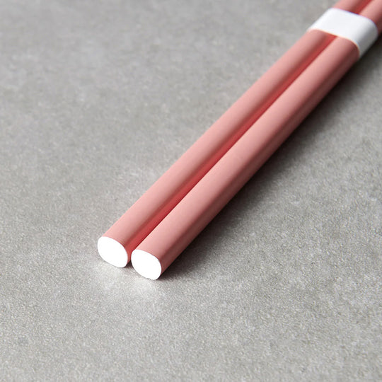 Pink lacquerware finish with white accent chopsticks from Made in Japan. This Chopstick collection is designed and made at the Zumi workshop in Fukui prefecture, Japan.