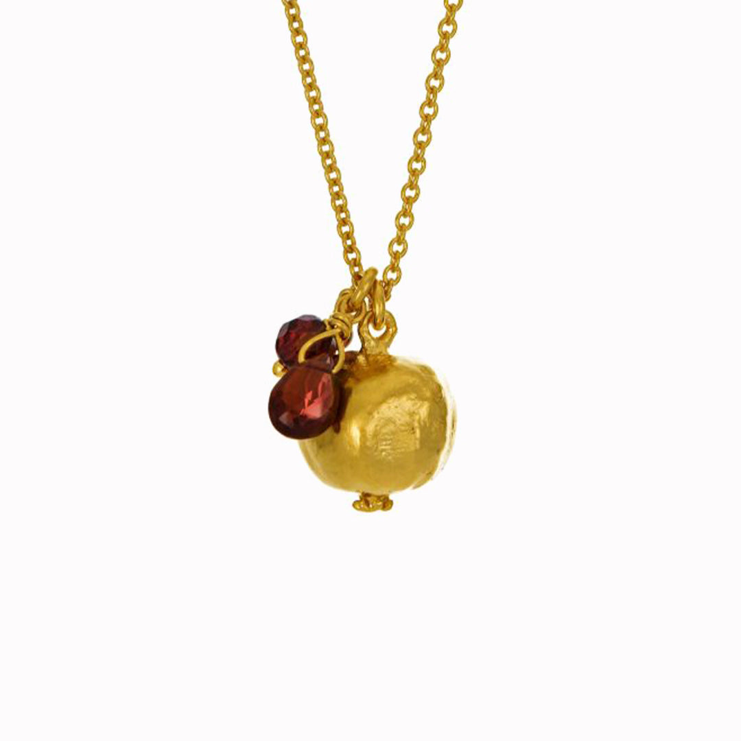 A symbol of beauty and abundance, this juicy Pomegranate Necklace is accented with a trio of vibrant garnets