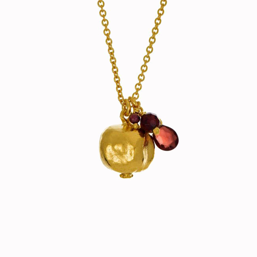 A symbol of beauty and abundance, this juicy Pomegranate Necklace is accented with a trio of vibrant garnets