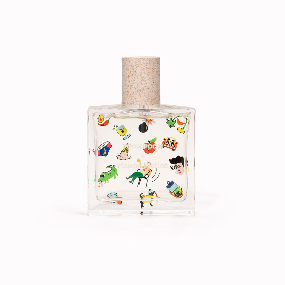 Maison Matine's 'Poom Poom' is a scent that is a carefree ode to life itself... floral, woody, musky and happy! The perfume comes in a beautiful illustrative bottle. 50ml bottle with cap off. Illustrated with cartoon-style imagery.
