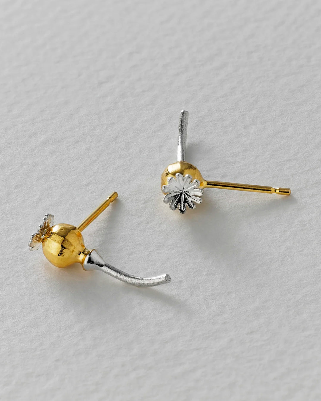 Poppy Head Stud Earrings are a sculptural and elegant pair of botanical stud earrings