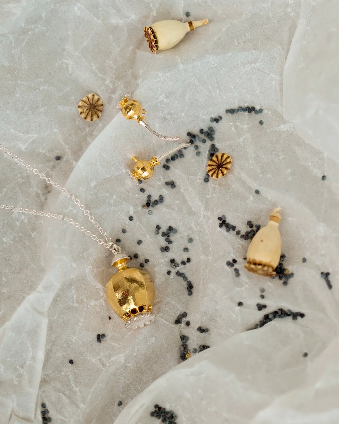 Poppy Head Stud Earrings are a sculptural and elegant pair of botanical stud earrings