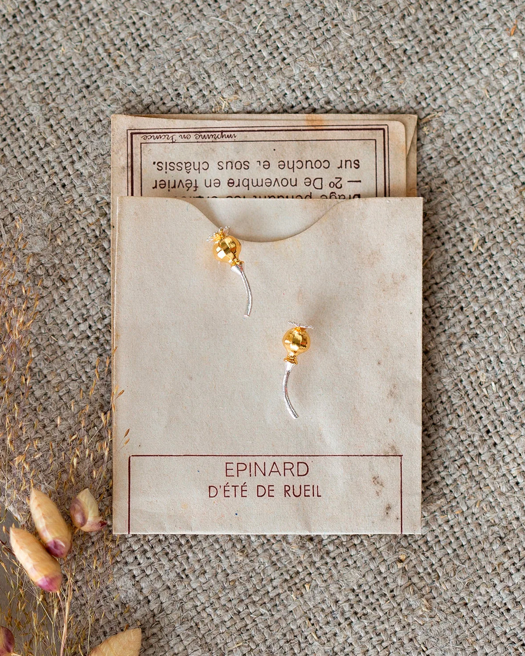 Poppy Head Stud Earrings are a sculptural and elegant pair of botanical stud earrings