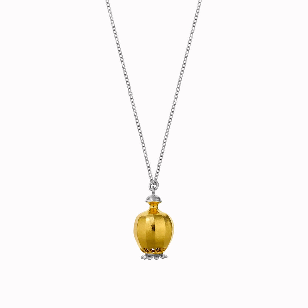 Large Poppy Head Necklace is a stunning sculptural botanical necklace in a mix of silver and gold plated metals. Inside the necklace are tiny silver ball 'shaking seeds' for a subtle sound feature.&nbsp;