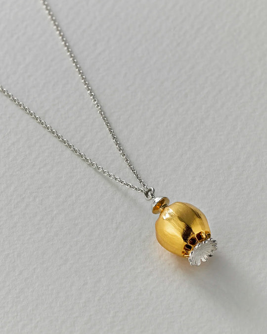 Large Poppy Head Necklace is a stunning sculptural botanical necklace in a mix of silver and gold plated metals. Inside the necklace are tiny silver ball 'shaking seeds' for a subtle sound feature.&nbsp;