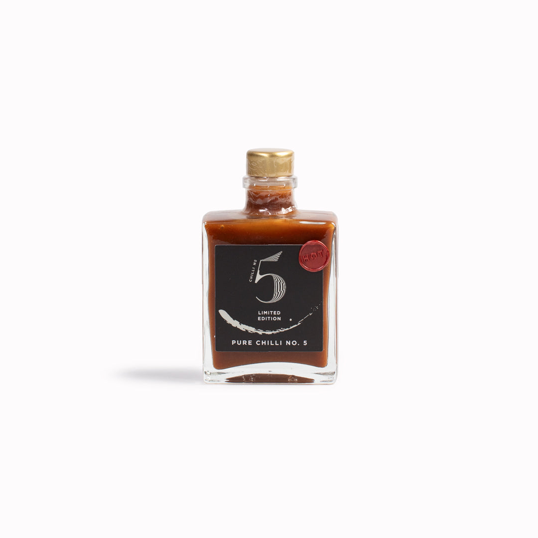 Pure Chilli No.5 is part of a limited edition luxury line of hot sauce from Chilli No.5. This sauce is the hottest of the No.5 range using a blend of Carolina Reaper, Scorpion, Ghost, Habanero, and No. 5 chillis. Phew!