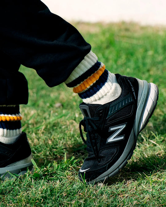 Ribbed socks based on the 1970s Tube Sock.
Extremely comfortable with a long pile cushioned sole. Wear with trainers (what else?) in cooler weather.
