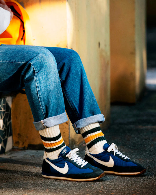 Ribbed socks based on the 1970s Tube Sock.
Extremely comfortable with a long pile cushioned sole. Wear with trainers (what else?) in cooler weather.