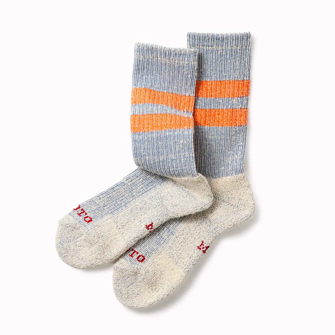 Introducing the Rototo Pile Stripe Marl Socks in Blue and Orange, a perfect blend of style and comfort. 