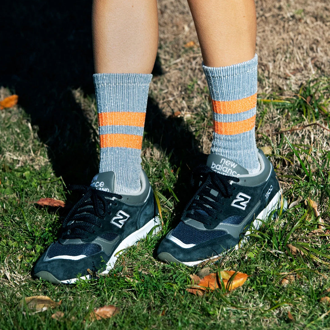 Introducing the Rototo Pile Stripe Marl Socks in Blue and Orange, a perfect blend of style and comfort. 