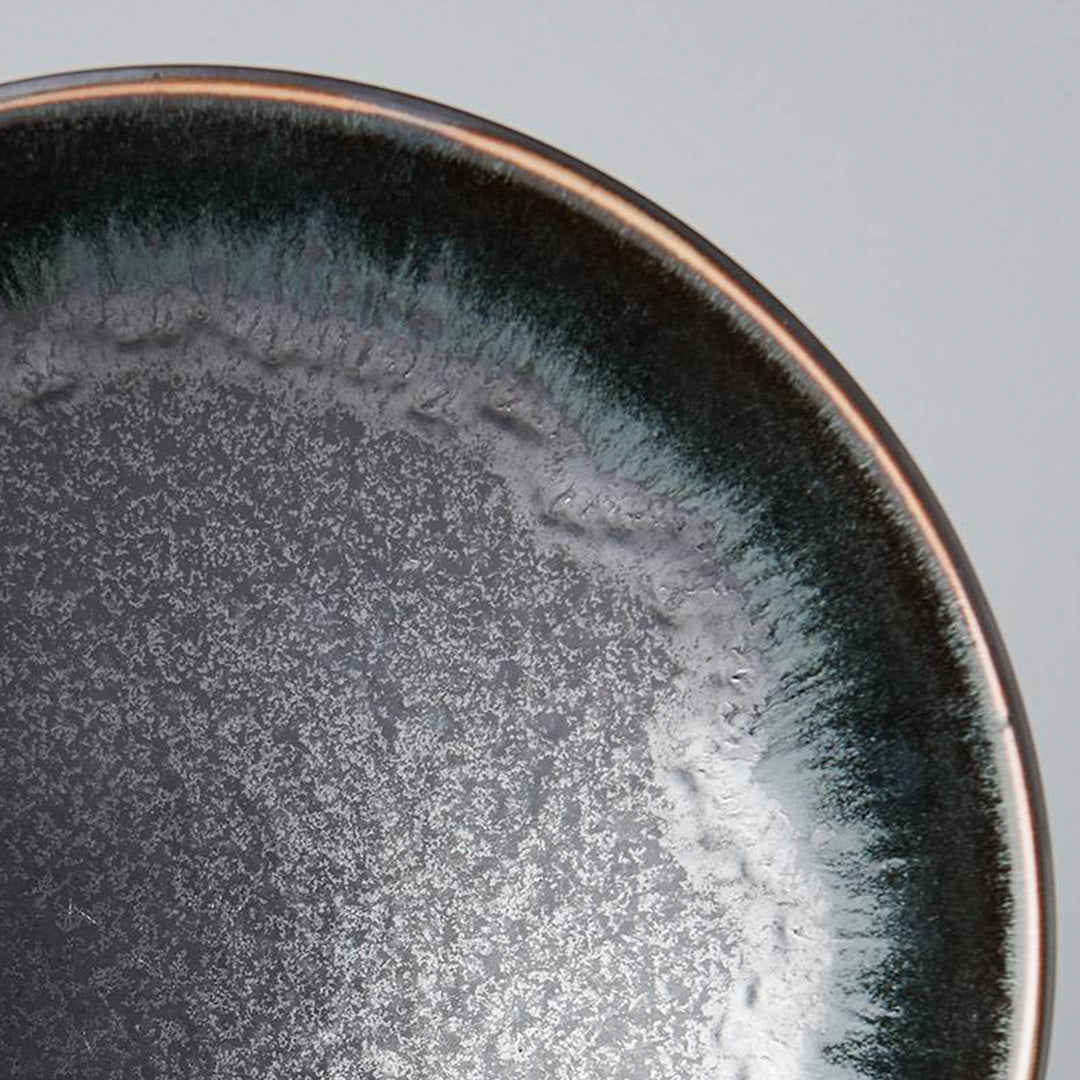 The Matt &amp; Shiny range features a silvered matt black body, with the edge hand-dipped in a rich glossy black. A subtle play of blue and green accents are hidden within the pooling of the glaze