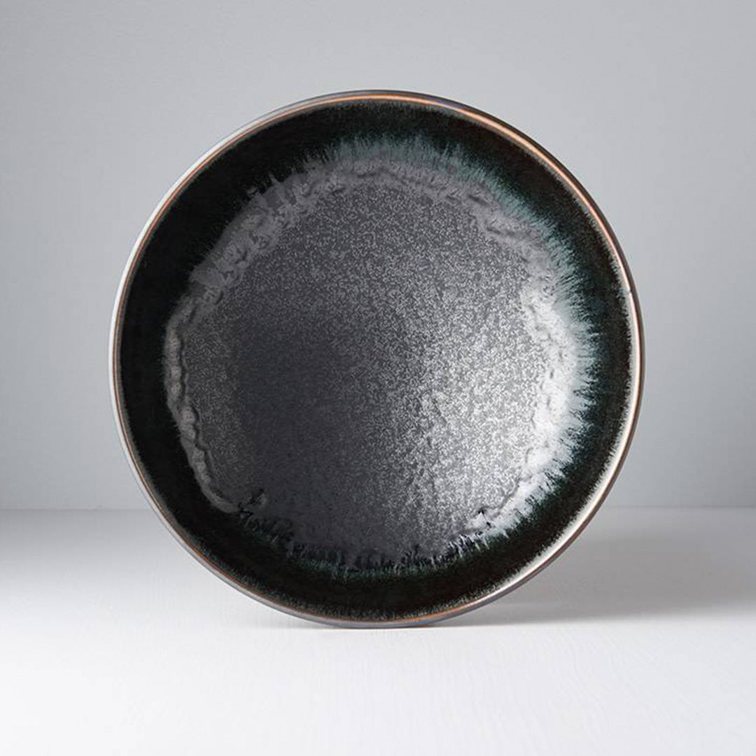 The Matt &amp; Shiny range features a silvered matt black body, with the edge hand-dipped in a rich glossy black. A subtle play of blue and green accents are hidden within the pooling of the glaze