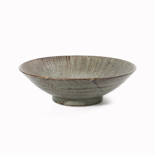 A stunning Japanese Mino ware Ramen bowl featuring a matt green glaze with striking dark green etched lines.