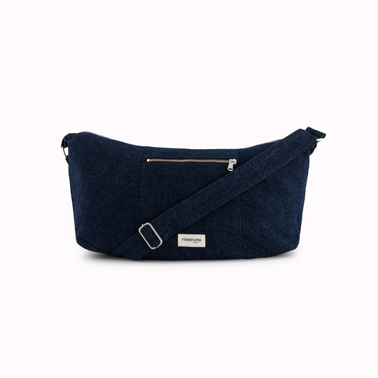 Wrapped View - Discover Charlot, the new recycled cotton crossbody bag from Rive Droite in raw denim. Can be worn as a shoulder bag or over the shoulder.