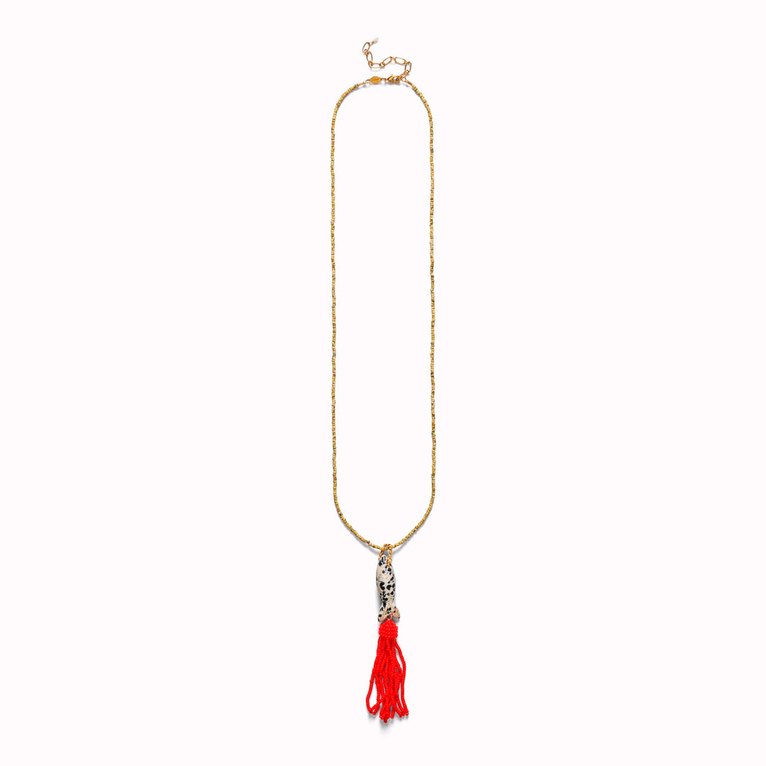 Tassel Fishy is a playful pendant necklace built around a long, fluid tassel form.