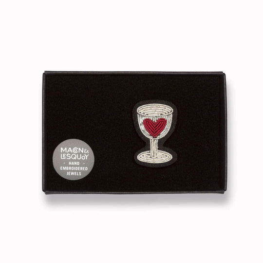 Hand-embroidered 'Red Wine Love' design lapel pin by Parisian fashion accessory brand Macon et Lesquoy. Measures approximately 33mm by 20mm.
