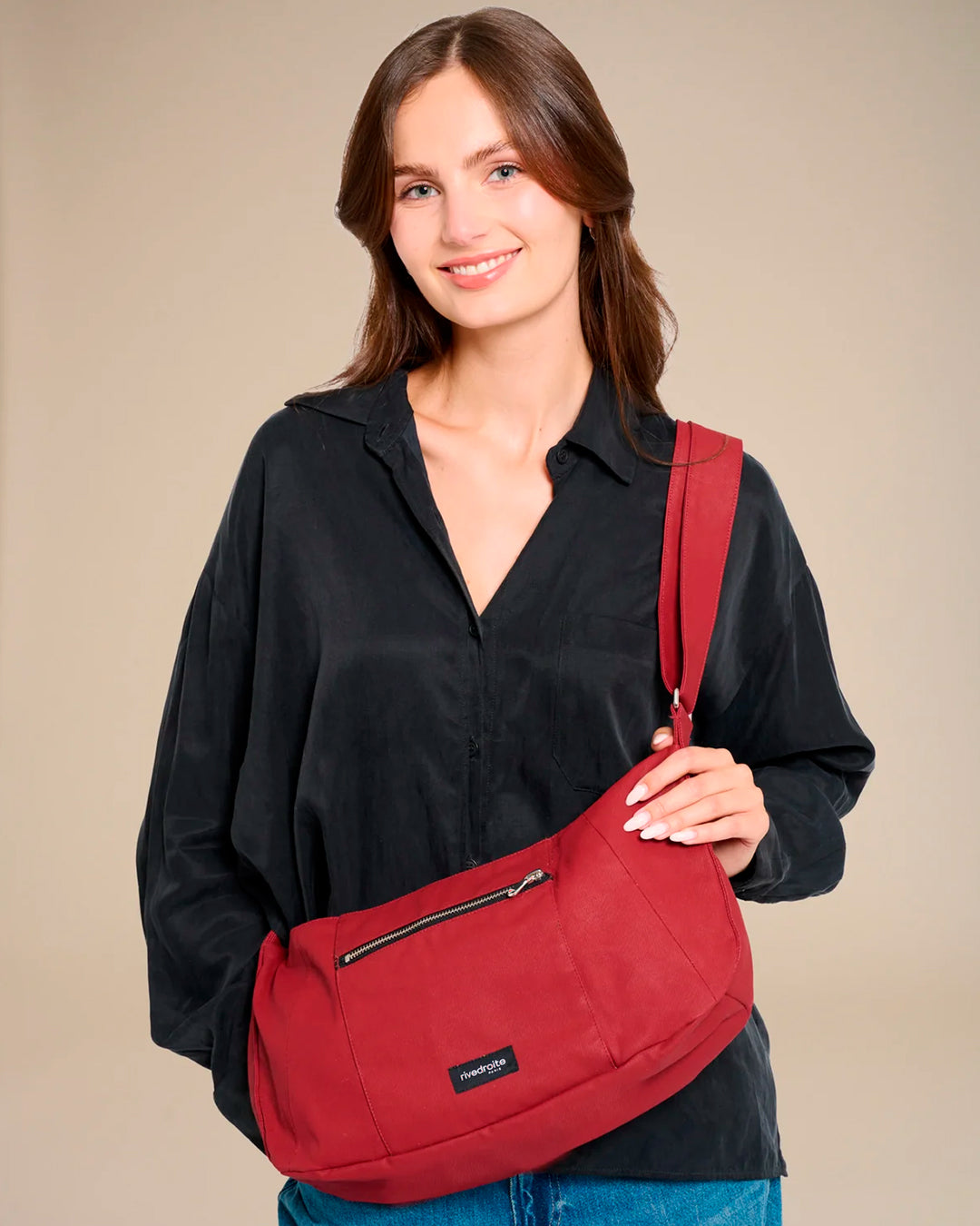 The Mini Charlot is a compact shoulder bag large enough for all your daily essentials. For AW26 the bag is made from a 100% organic cotton canvas fabric with a water resistant coating