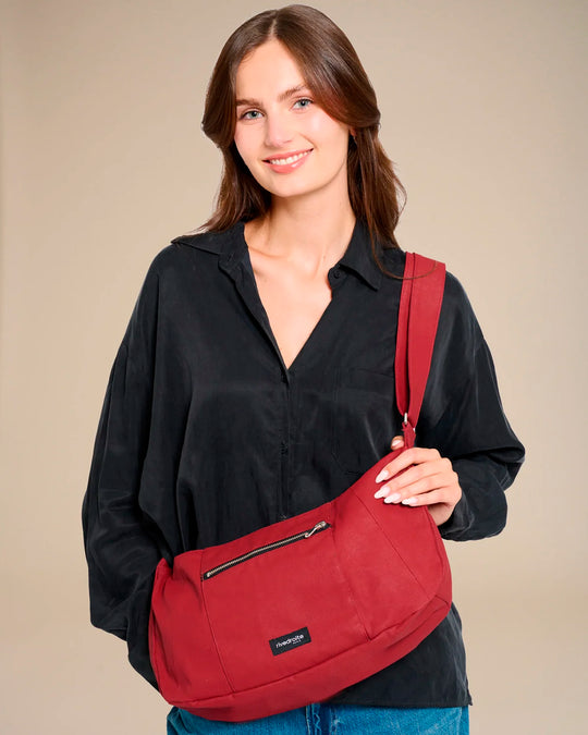 The Mini Charlot is a compact shoulder bag large enough for all your daily essentials. For AW26 the bag is made from a 100% organic cotton canvas fabric with a water resistant coating