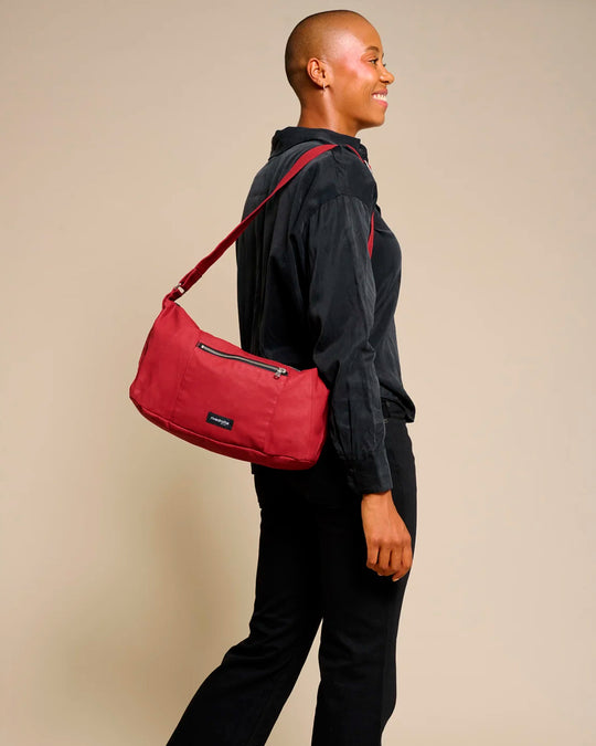 The Mini Charlot is a compact shoulder bag large enough for all your daily essentials. For AW26 the bag is made from a 100% organic cotton canvas fabric with a water resistant coating