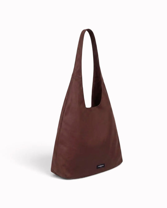 The Richelieu is Rive Droite's roomy hobo bag, made with a waxed finish to give their AW26 collection a richer colour and a worn in appearance over time