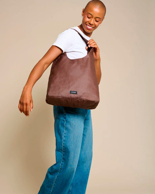 The Richelieu is Rive Droite's roomy hobo bag, made with a waxed finish to give their AW26 collection a richer colour and a worn in appearance over time
