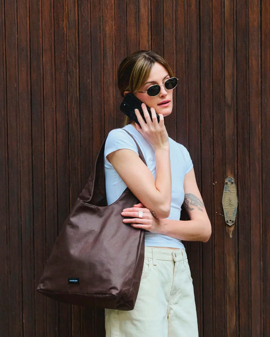 The Richelieu is Rive Droite's roomy hobo bag, made with a waxed finish to give their AW26 collection a richer colour and a worn in appearance over time