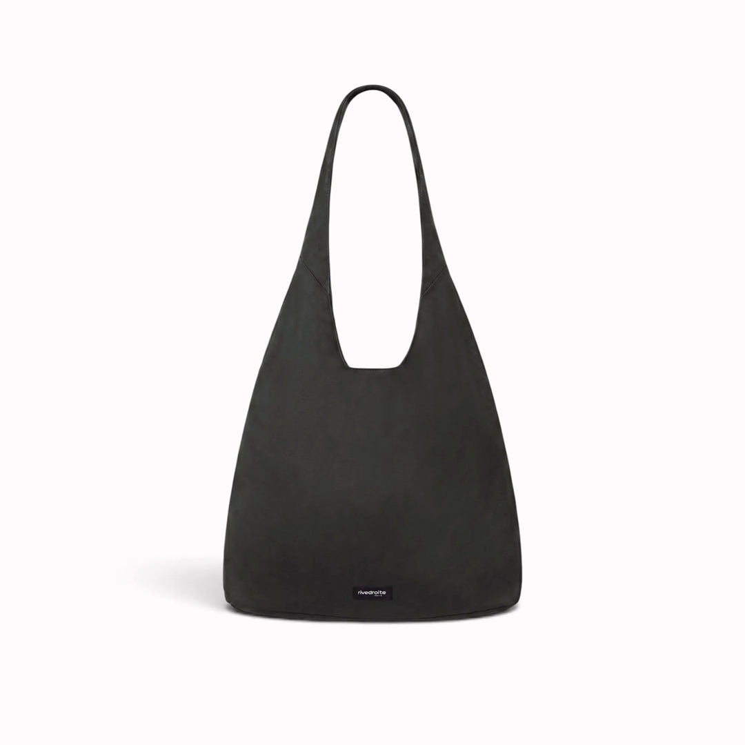 The Richelieu is Rive Droite's roomy hobo bag, made with a waxed finish to give their AW26 collection a richer colour and a worn in appearance over time